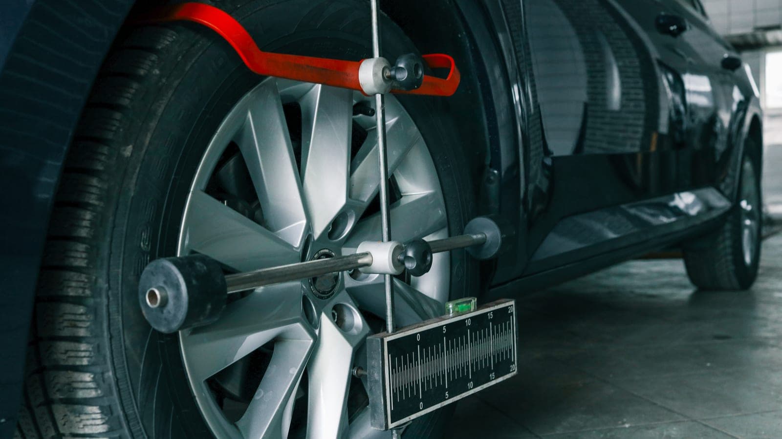Wheel alignment equipment on a vehicle's front wheel