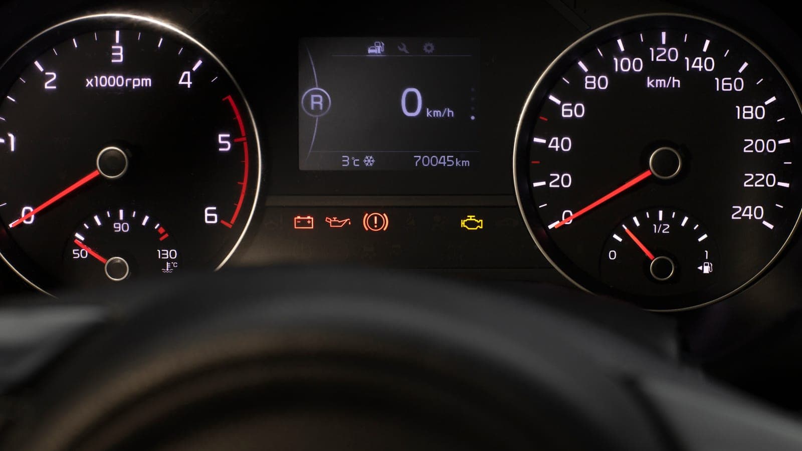 Check engine warning light on a dashboard